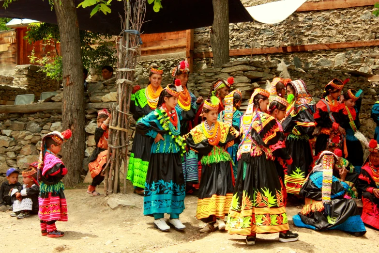 several native people from different ethnic countries dressed in costume