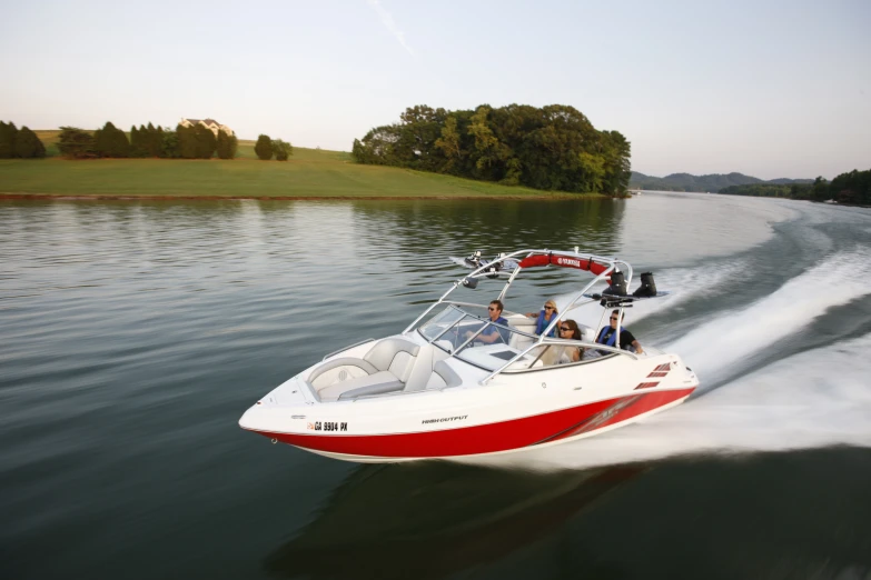 a boat riding through a body of water