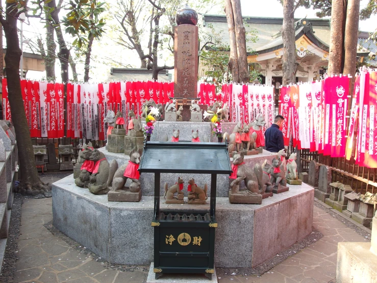 a small shrine with statues made out of cement
