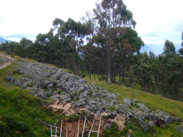 a large pile of rocks is set up on the side of a hill