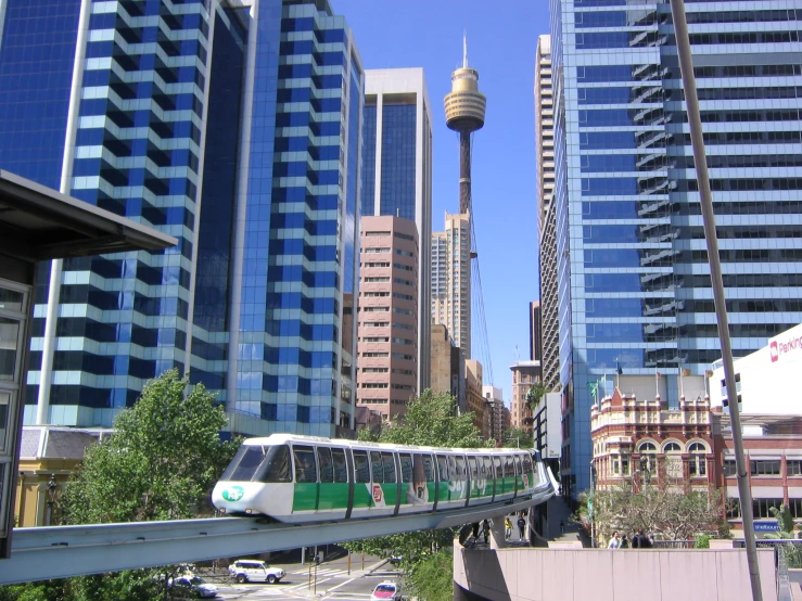 a monorail running through an urban city on its way