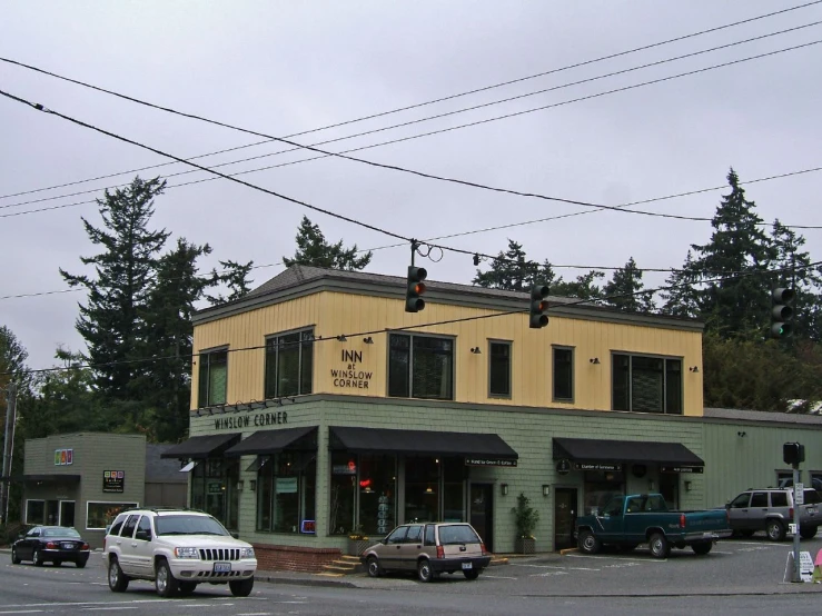 a small group of vehicles parked at an intersection