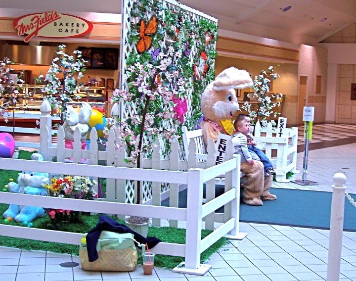 inflatable rabbit decoration is displayed inside an indoor mall