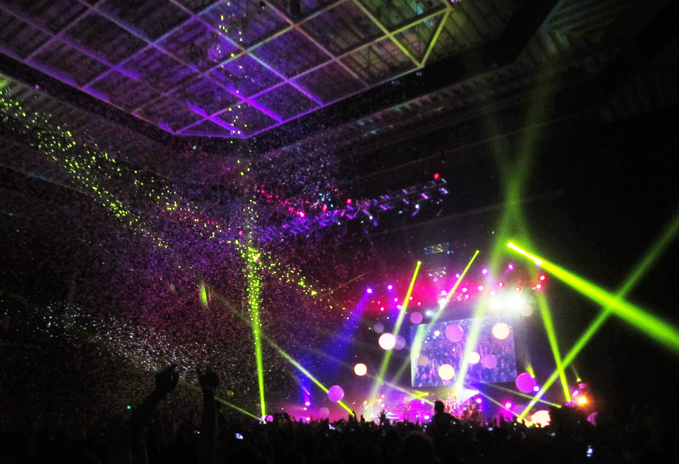 people are looking at an outdoor concert that is being set