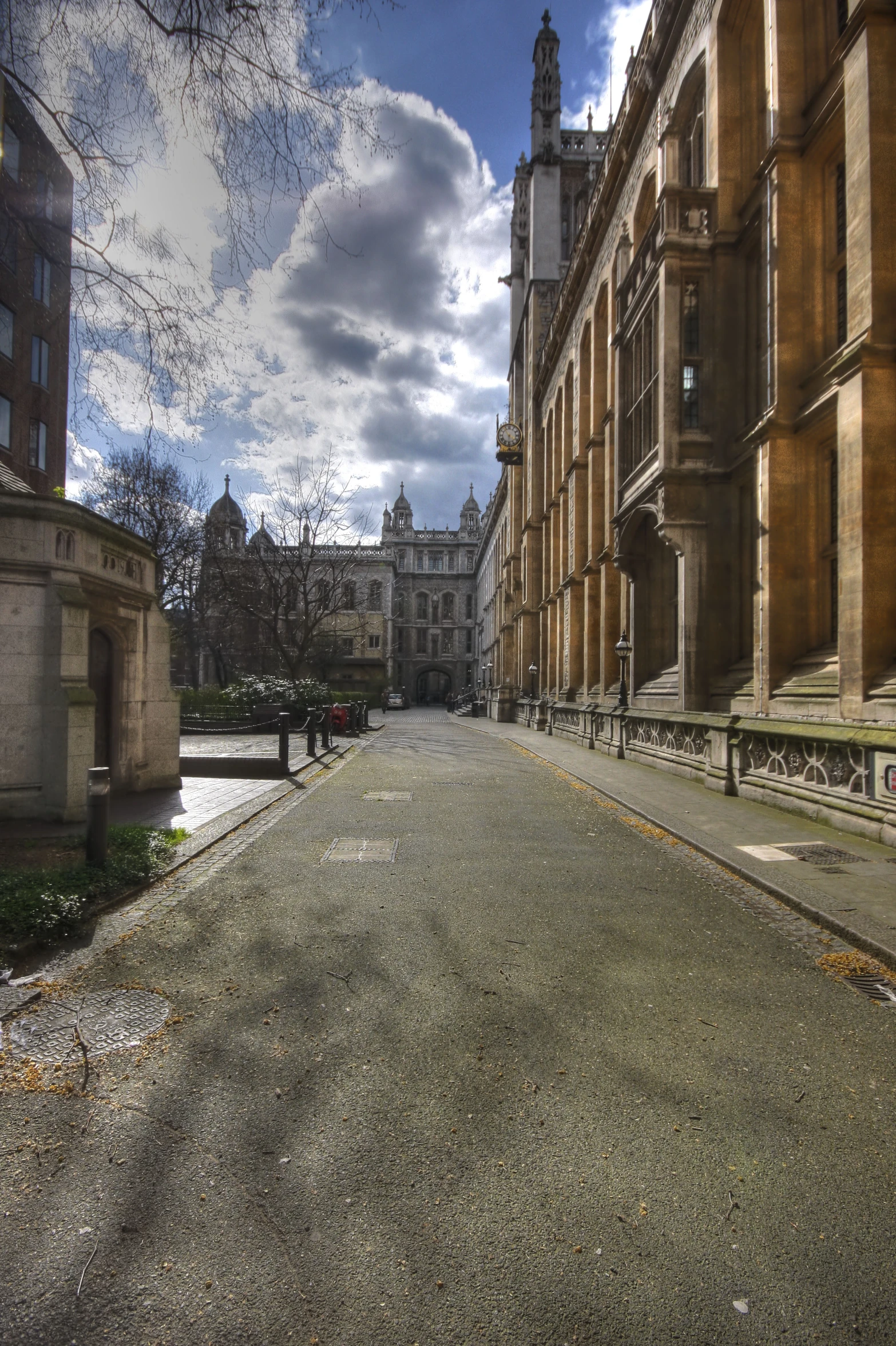 the street leading to an old building is empty