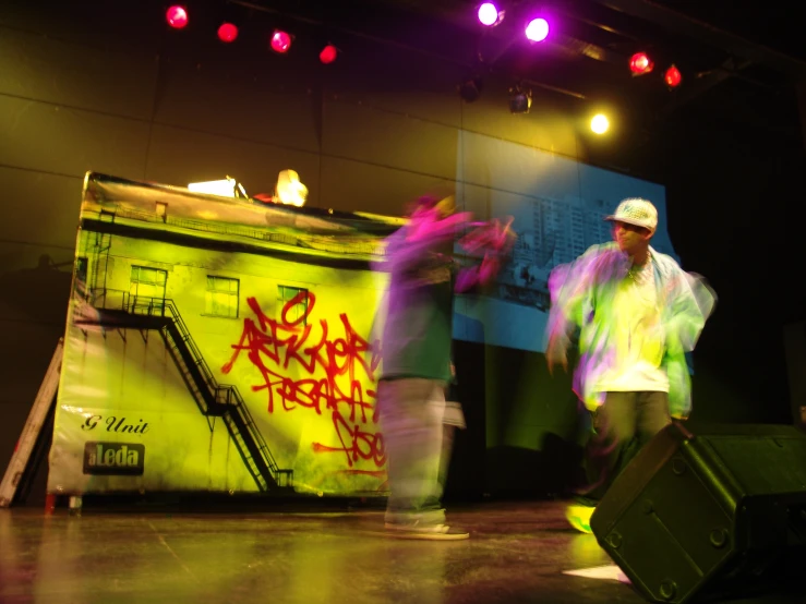 men in neon colored clothing holding their luggage