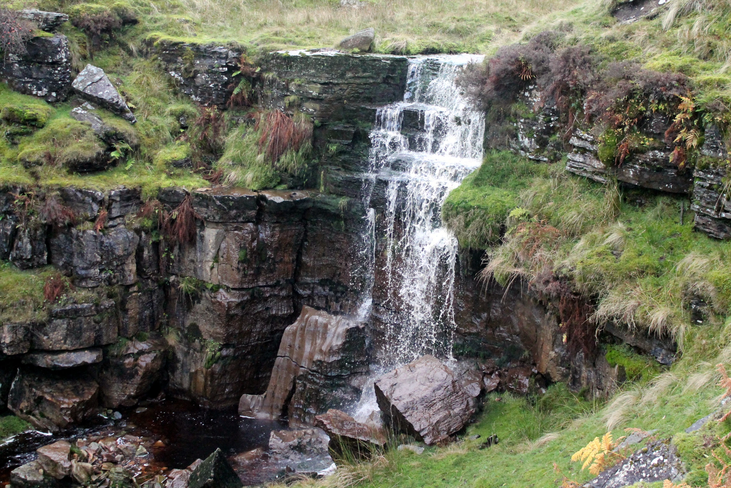 the waterfall is very narrow and has many water casings