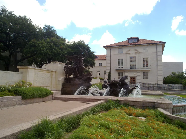 water fountain in front of a large white building