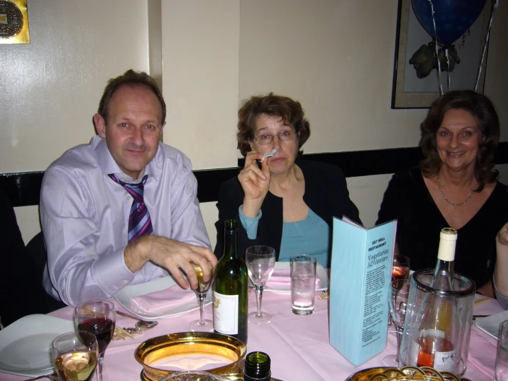 a man and woman sitting at a table together