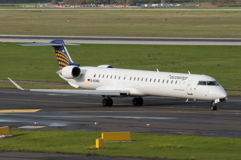 a large commercial airplane sits on the runway