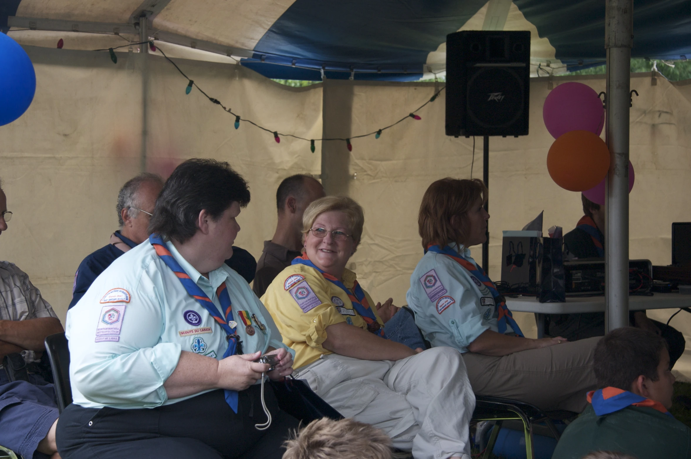 an image of group of people sitting together