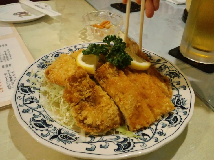 a plate full of fish with some garnishes on it