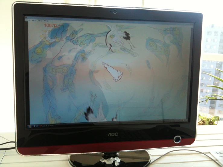 a television showing various drawings of animals