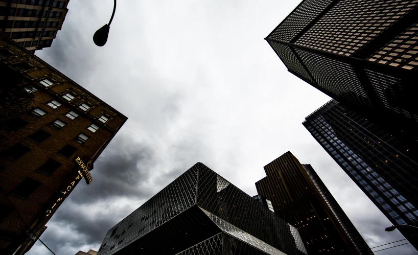 looking up at a group of tall buildings