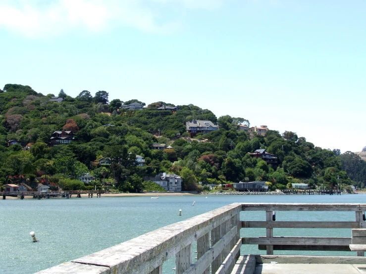 a view of the ocean and a few benches on the dock