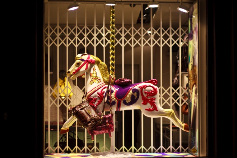 a carousel ride with a large horse at the top