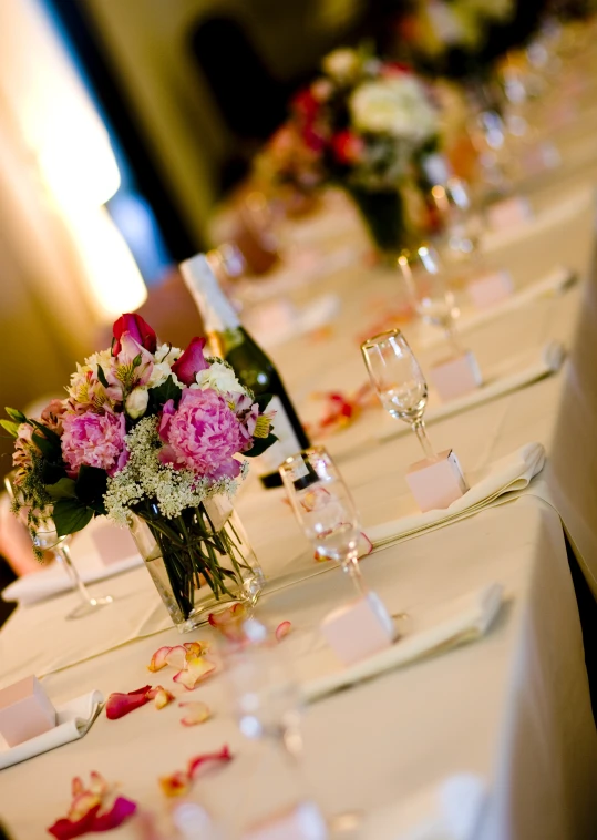 a white table topped with lots of white tables cloth