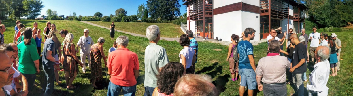 a large crowd of people line up in a circle