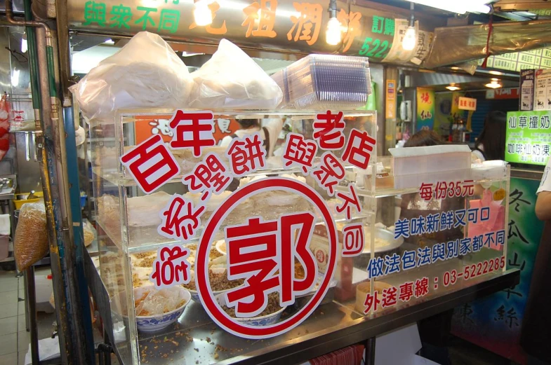 a man with a smile on his face in front of a store