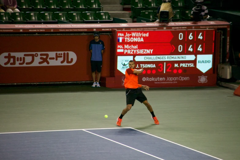 the tennis player is hitting a ball on the court