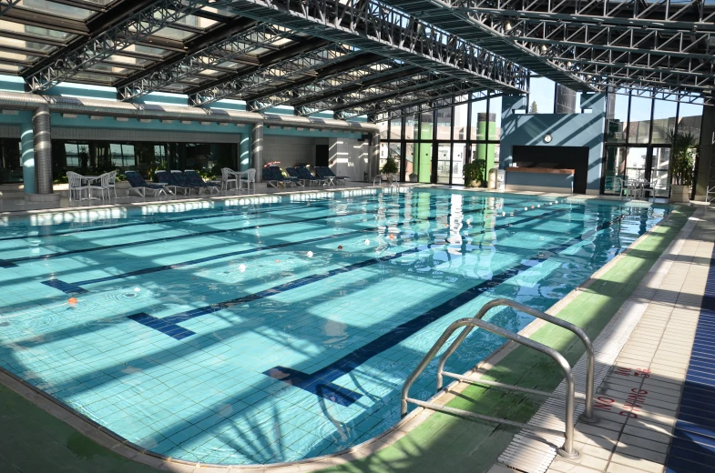 an empty swimming pool inside of an indoor building