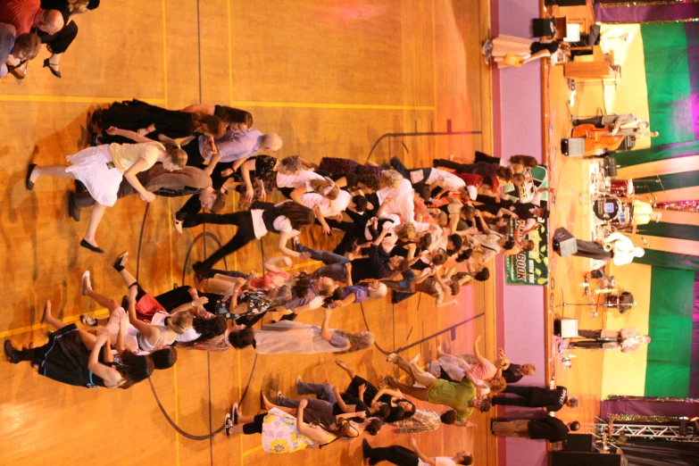 several groups of people performing at a ballroom