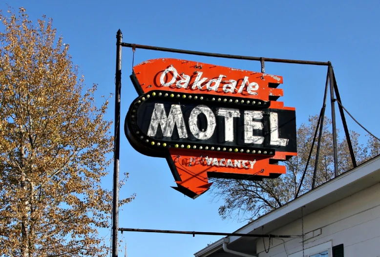 the neon sign says, orchid motel