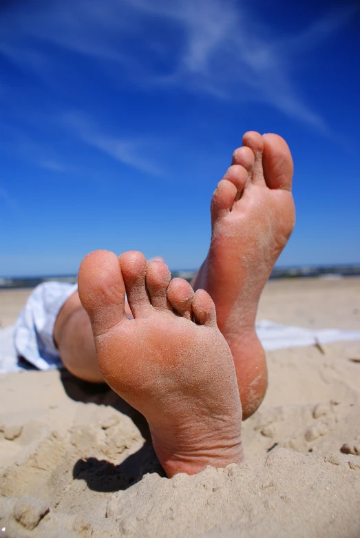 a person lying down with their feet propped up