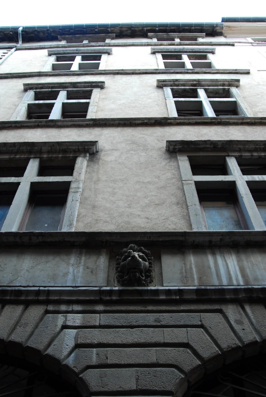 a decorative statue adorns the corner of a building