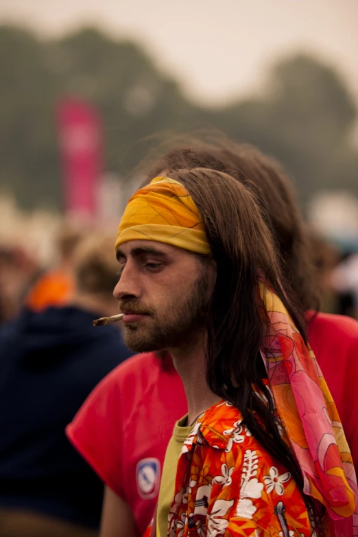 a man with a cigarette in his mouth