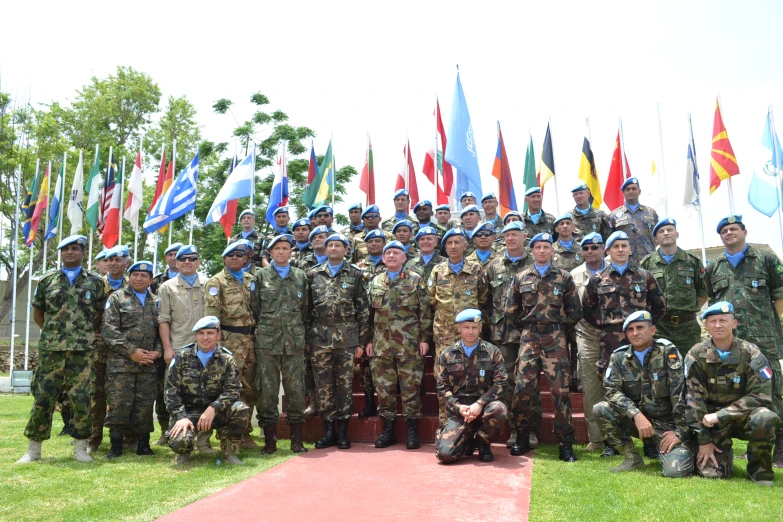 a group of men in uniform posing for a picture