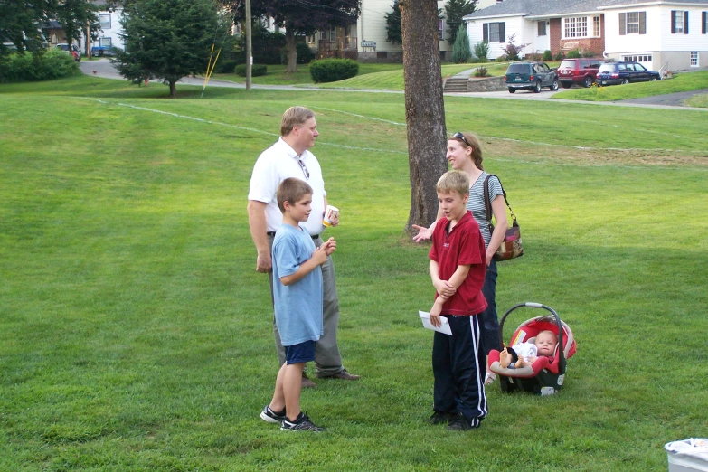 the family is on the field in the green