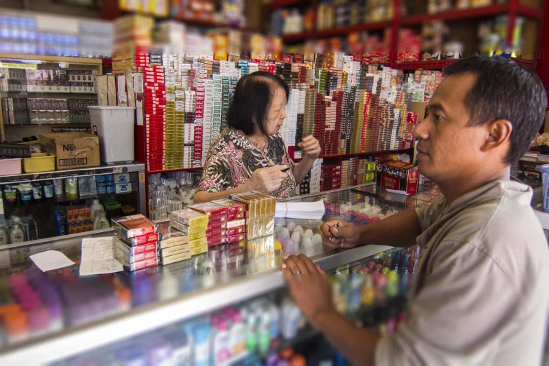 a man is ordering items to a woman at the store