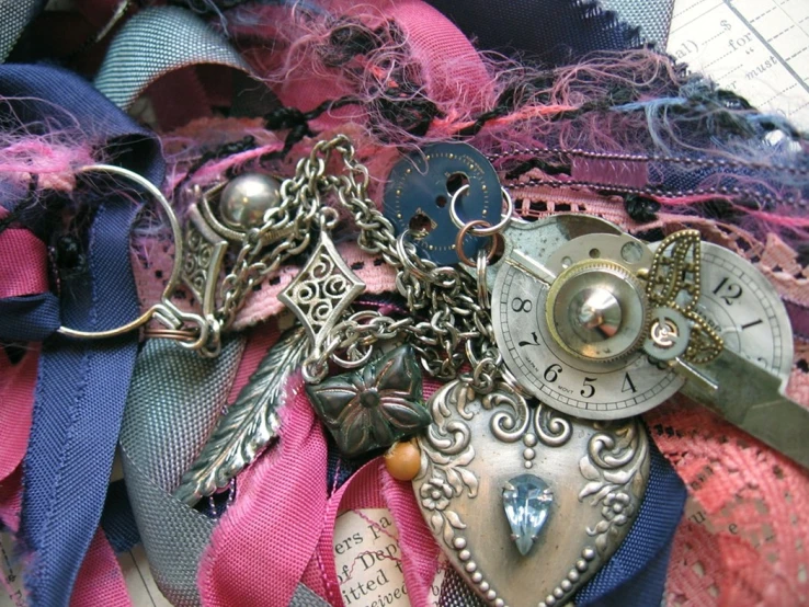 a pocket watch is on top of laces