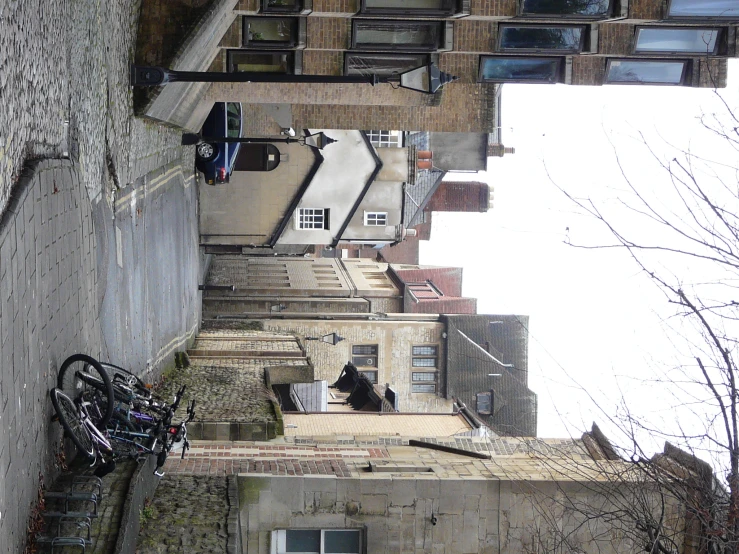 two bikes on a cobblestone path in a city