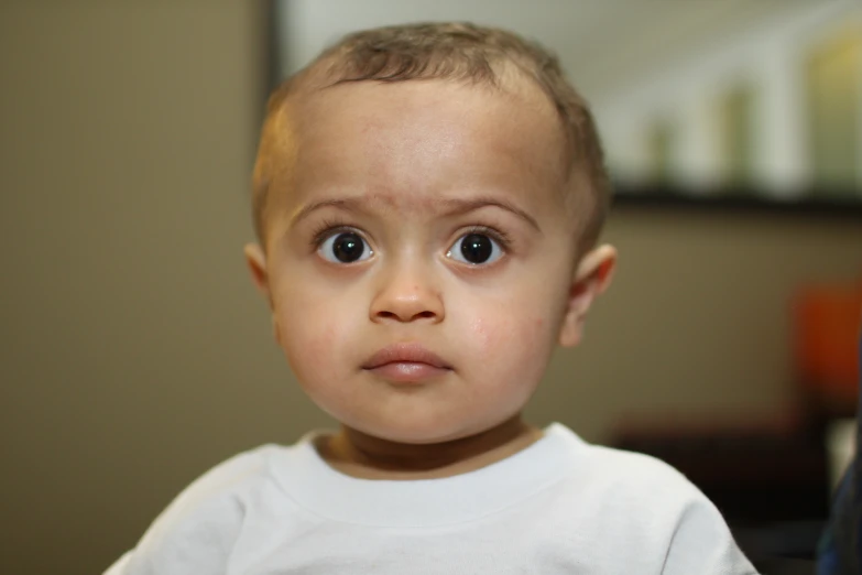 a young child with very large blue eyes