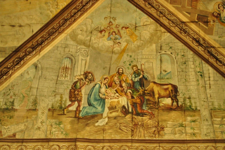 an ornately decorated wall with a picture of jesus and animals in a castle