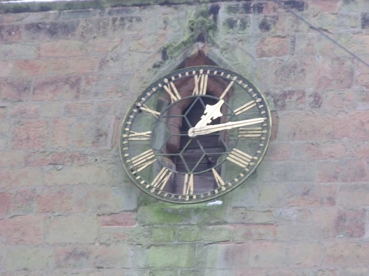 a clock is on the side of a building