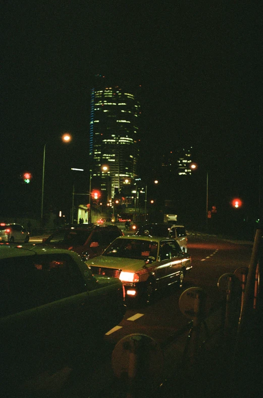 a night view of a city skyline at an intersection