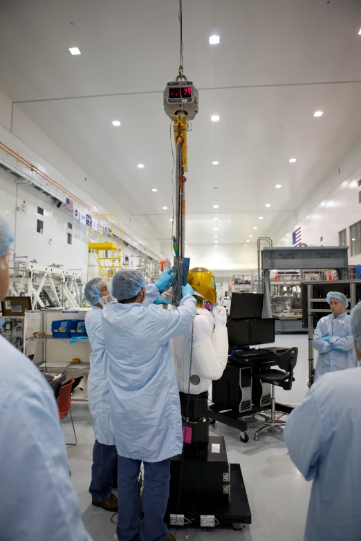 workers wearing blue and blue work at a factory