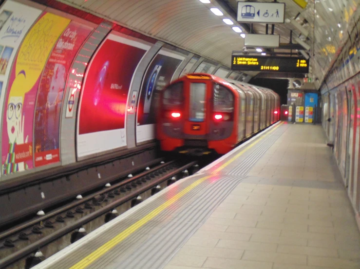 a subway train moving in between two platforms