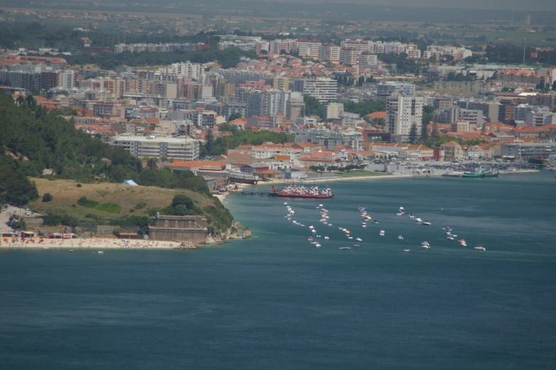 several boats in the water on a city skyline