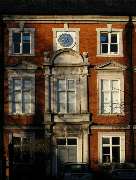 a building with a clock on it that has windows