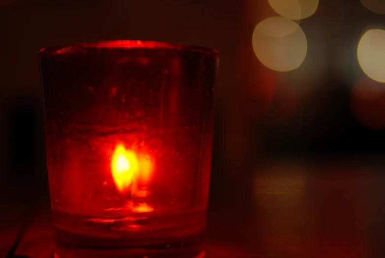 a candle that is sitting in a glass