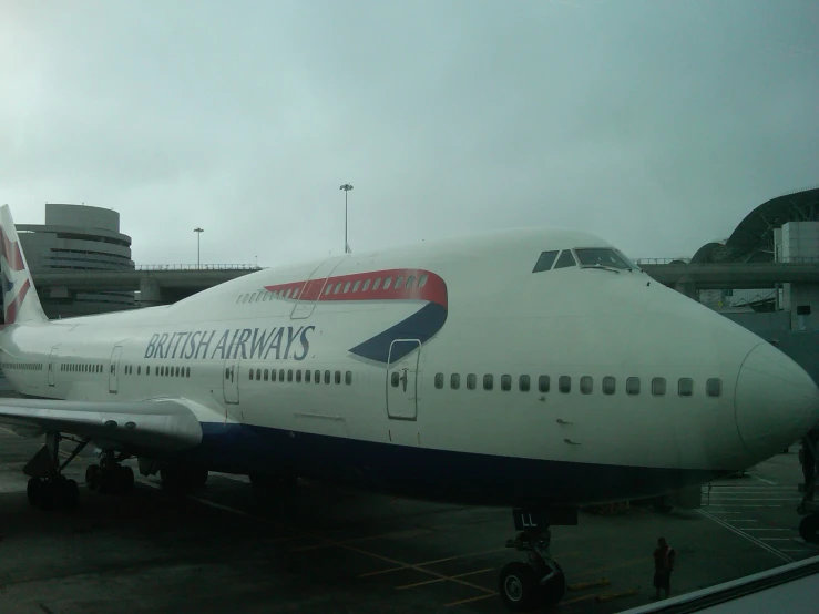 a large jetliner sitting on top of an airport runway