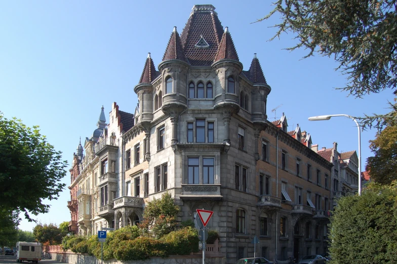 a tall building that has a tower and many windows