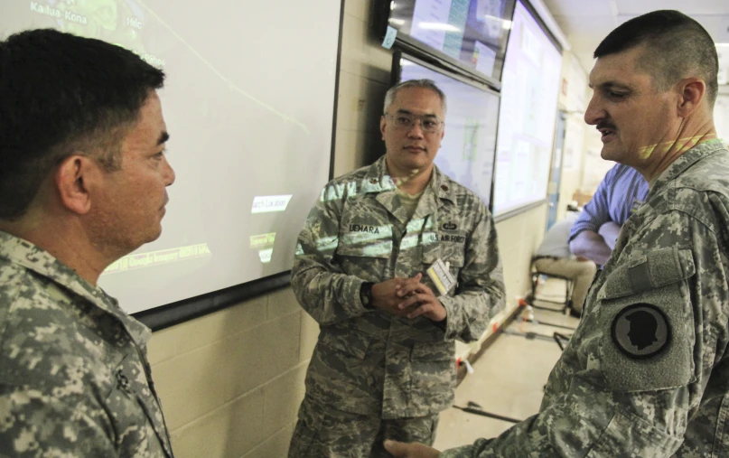 a group of men in army uniforms shake hands