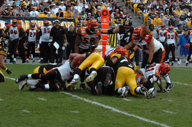 the football players are playing on the field