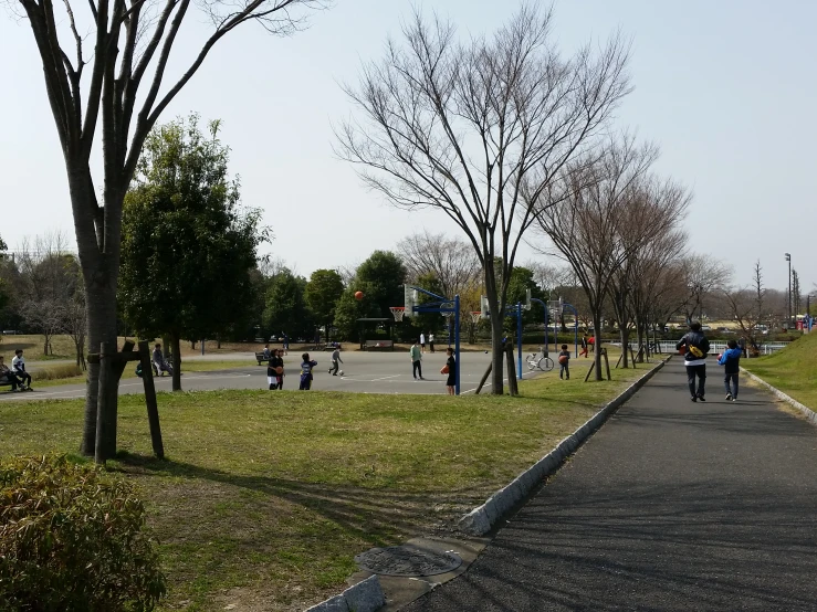 a man riding on the back of a skateboard down a paved road