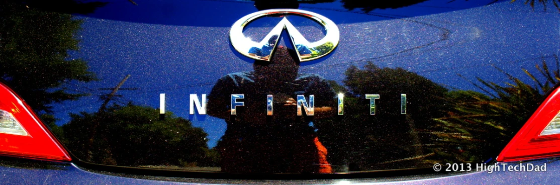 the back of a blue car with logo and lettering